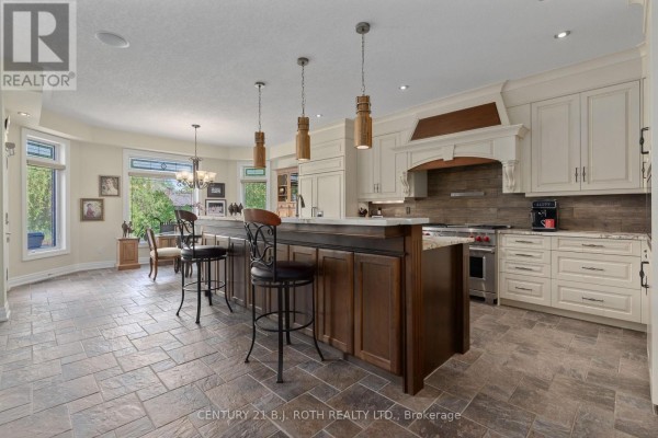 Modern bathroom with a walk-in glass shower, tiled walls, and a decorative window. - 75 Marine Drive, Innisfil