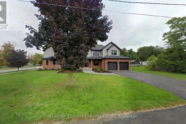 Large two-story home with brick base, siding upper levels, and a double garage. - 750 Havelock Street N, Huron Kinloss