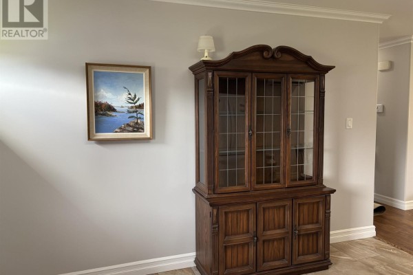 Living room with a television on the wall, furniture, and a large window overlooking the yard. - 751 Route 25, 751 York Road, York
