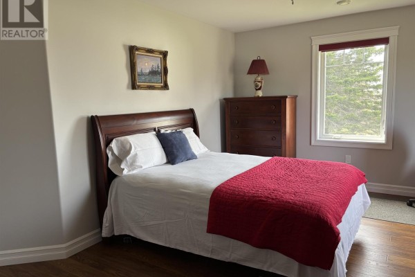 Living room and dining area with furniture, televisions, and a view into the kitchen and hallway. - 751 Route 25, 751 York Road, York