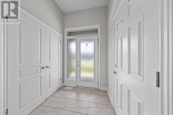 Empty bedroom with neutral paint, carpet, and a double closet. - 754 Brian Good Avenue, Ottawa