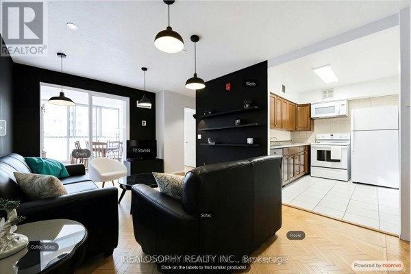 Living room with two red sofas, a coffee table, and parquet flooring. - 756 - 24 Southport Street, Toronto