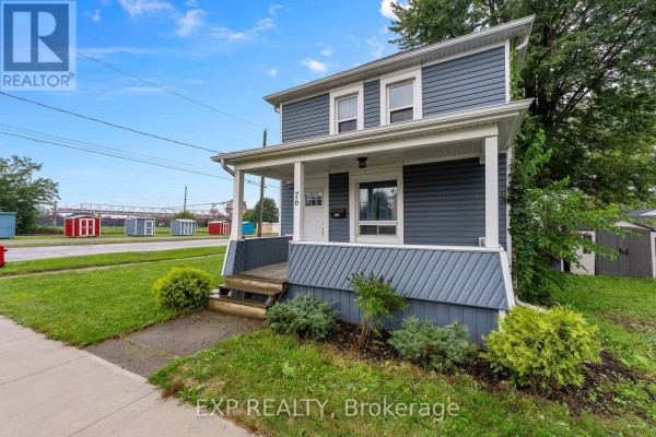 Blue house with porch, siding and steps - 76 Bell Street Port Colborne