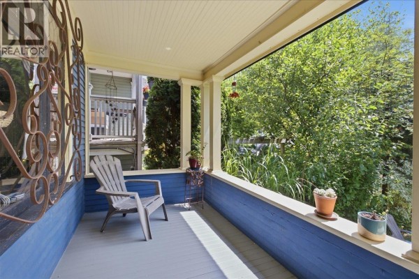 View from the porch overlooking green trees and foliage. - 761 E 15th Avenue, Vancouver