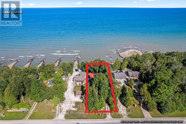 Aerial view of properties along Lake Huron, with a red rectangle highlighting the subject property. - 763 Bruce Road 13, Native Leased Lands