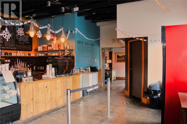 View of the service counter and seating area in a commercial space. - 77 8th Avenue, Lillooet