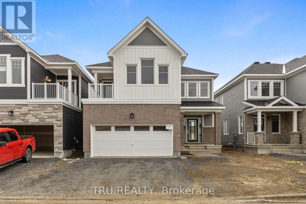 Street view of a residential property with a dark gray roof and white vertical siding on the upper level. - 77 Hackamore Crescent, Ottawa