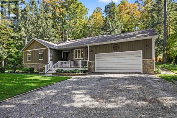 Driveway leading to a bungalow with brown siding, stone accents, and an attached garage. - 77 Lorlei Drive, Mcnab/braeside