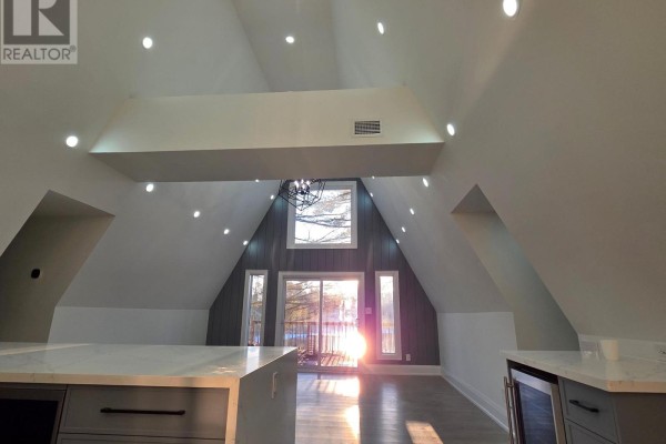 Spacious interior with vaulted ceiling, large windows, and natural light - 7701 Doner Drive, Severn