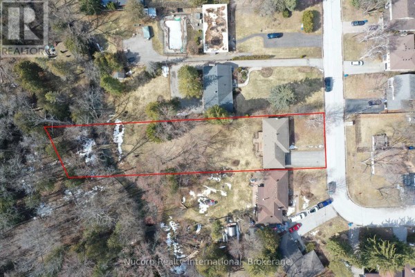 Aerial view of the property lot boundaries, house, driveway, and surrounding neighborhood. - 774 Sutherland Avenue, Newmarket