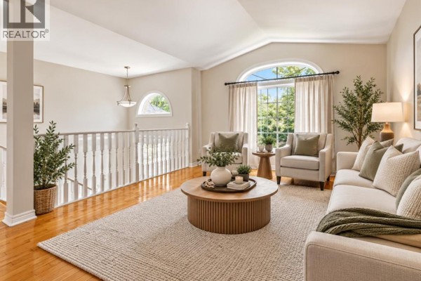 Bedroom with a king-size bed, two nightstands, a bench, and modern art. - 776 Dynasty Street, Windsor