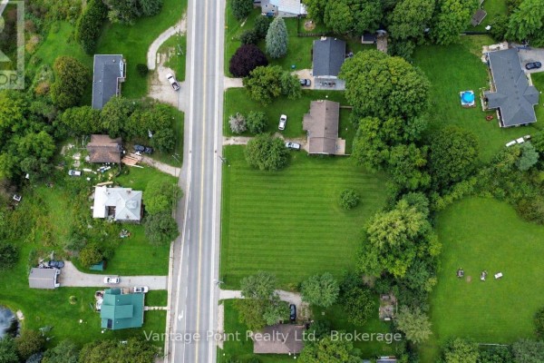 Aerial view of the grassy lot with property boundaries highlighted by a white outline. - 777011 10 Highway, Chatsworth