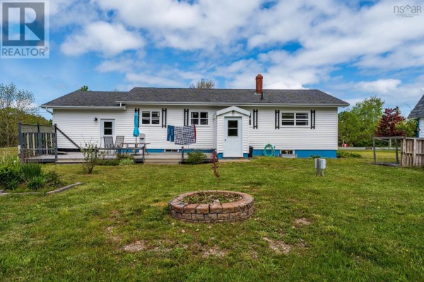 U-shaped kitchen with white cabinets, gray countertops, stainless steel dishwasher, and checkered tile floor. - 7784 Highway 101, Plympton