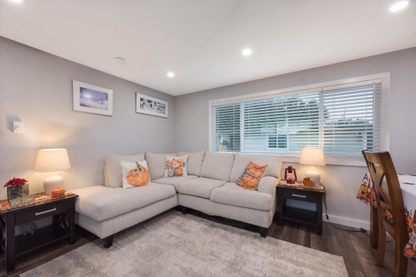 Modern kitchen with stainless steel appliances, white cabinetry, and large windows - 78 5742 Unsworth Road, Sardis South, Chilliwack