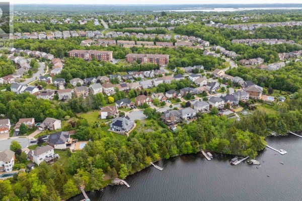 Aerial view of two homes on a cul-de-sac with a frozen lake in the background. - 78 Edgewater Close, Dartmouth