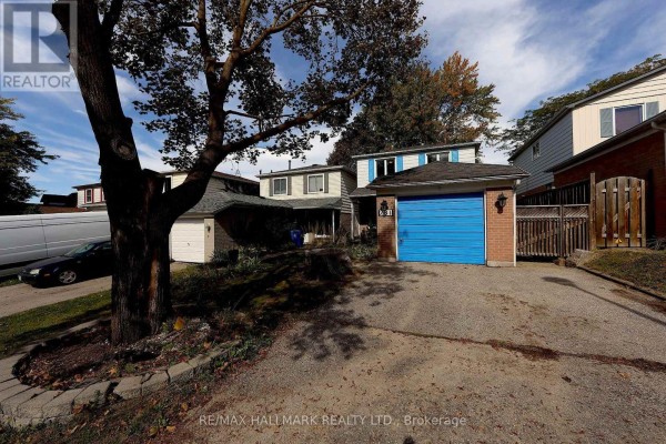 View of the house exterior from the driveway, showing a tree and neighboring properties. - 781 Pam Crescent, Newmarket