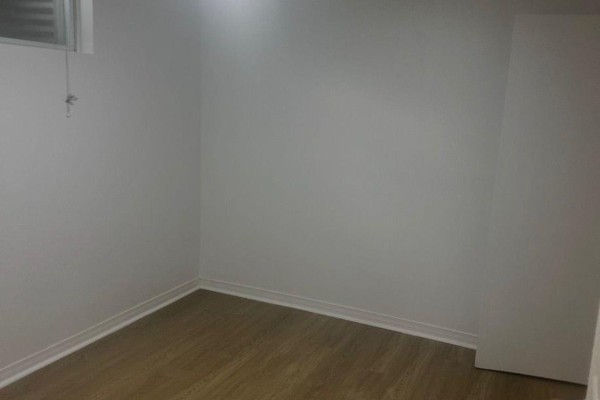 Empty room with wood-look flooring and white walls and trim. - 783 Consort Crescent, Mississauga