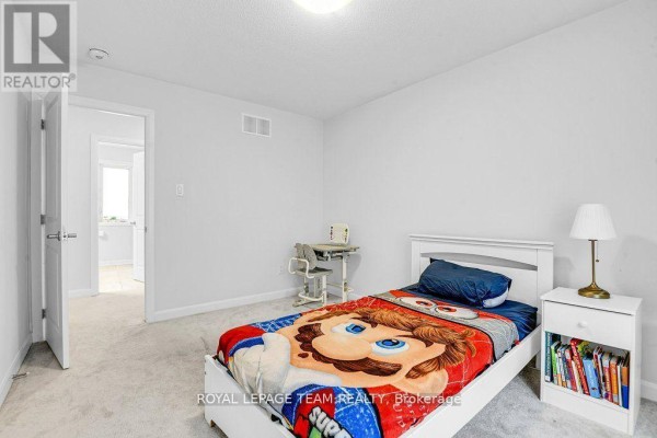 Bedroom with single bed, Mario comforter, desk, and nightstand - 784 Cappamore Drive Ottawa