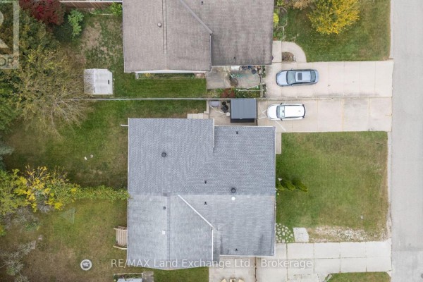 Overhead aerial view of a residential street with bungalows and parked cars. - 789 Eastwood Drive, Saugeen Shores