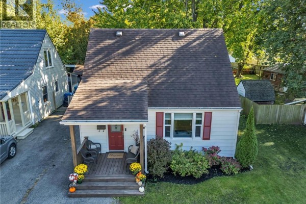 Aerial view of the front of a white house with a dark roof and porch. - 79 Brydges Street, Stratford