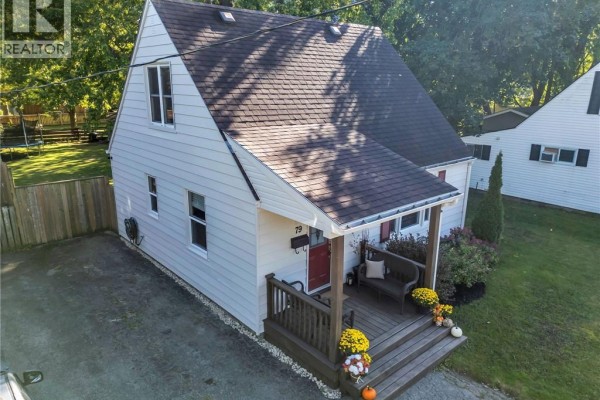 Aerial view of the side and front of a white house with a porch and lawn. - 79 Brydges Street, Stratford