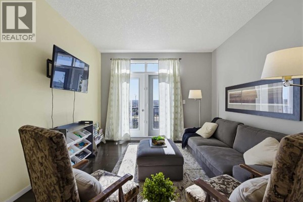 Interior room with unfinished walls, a window with blinds, bookshelves, and assorted items. - 79 Evansview Gardens Nw, Calgary