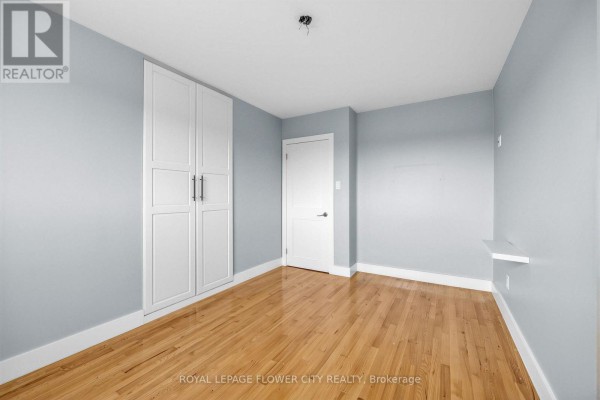 Bedroom with built-in closet and hardwood floors - 79 Kimberly Drive Hamilton