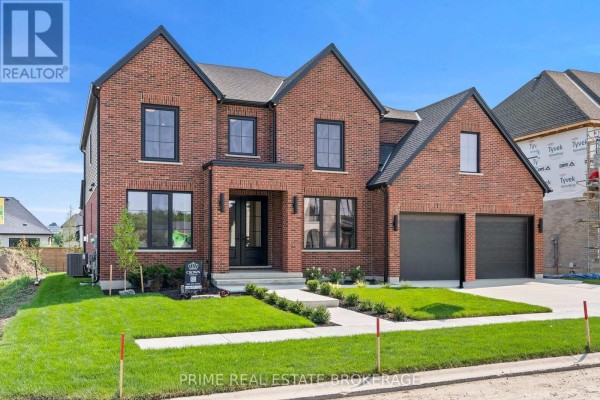 Home office with a dark desk, modern chair, six framed pictures, and large window with light curtains. - 793 Valleystream Walk, London North
