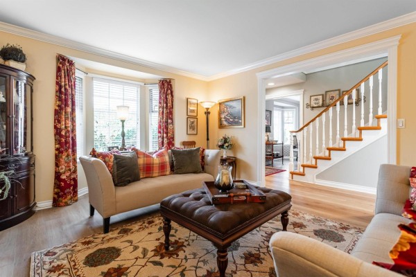 Aerial view of a large grey home with a three-car garage and spacious backyard. - 7930 144 Street, Surrey