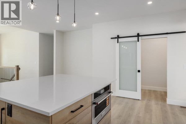 Spacious pantry with white shelving and wood flooring - 796 Kuipers Crescent Unit# 27, Kelowna