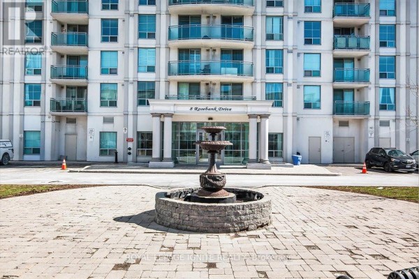 Modern kitchen featuring stainless steel stove, microwave, and granite surfaces - 7g - 8 Rosebank Drive, Toronto