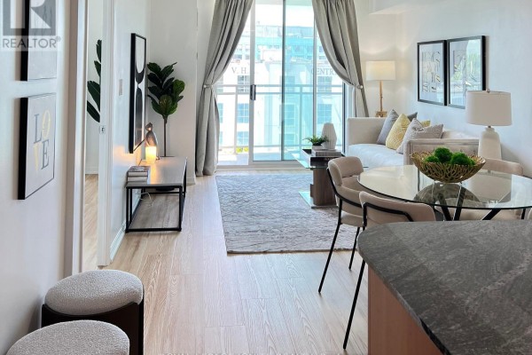 Bright bedroom with large window offering city views and light-colored flooring - 7g - 8 Rosebank Drive, Toronto
