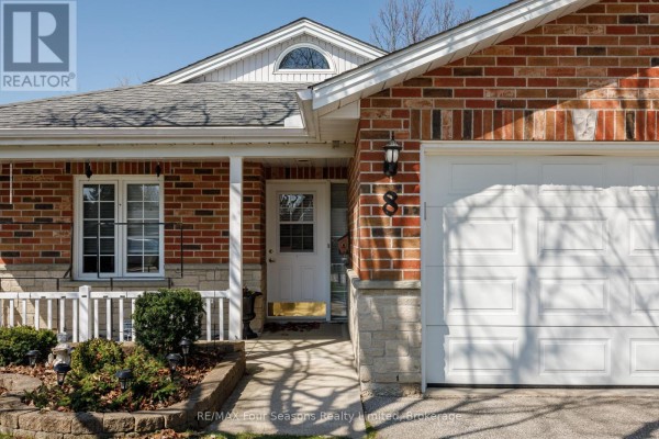 Porch area with seating, brick walls, and welcome mat - 8 - 275 Huron Street, Clearview