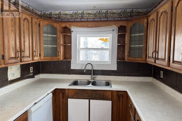 Laundry room featuring a washing machine and colorful walls. - 8 Allan J Memorial Avenue, Inverness