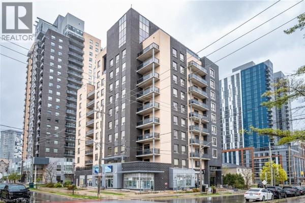 Angle view of the apartment building with multiple balconies and modern windows. - 8 Hickory Street W Unit# 404, Waterloo