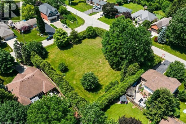 Aerial view of the property and neighborhood at 8 Northlawn Ave, Waterdown, with surrounding greenery. - 8 Northlawn Avenue, Waterdown