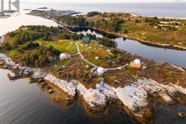Overhead view of an island with multiple geodesic domes, a cabin, and surrounding water. - 8 Simmons Island, Water Access, West Dover