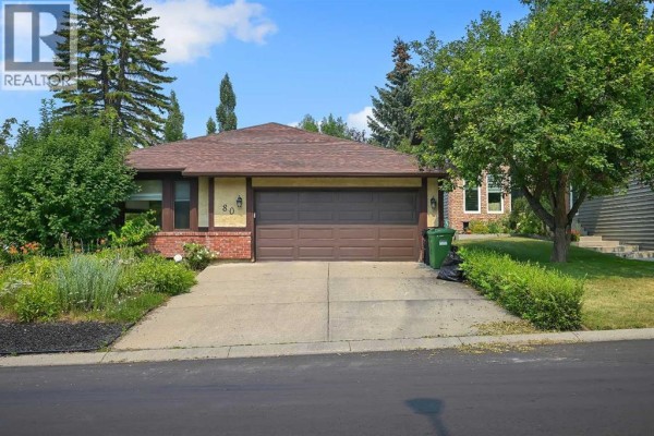 Front entrance of 80 Edforth Way NW, Calgary with a stone walkway leading to the front door. - 80 Edforth Way Nw, Calgary