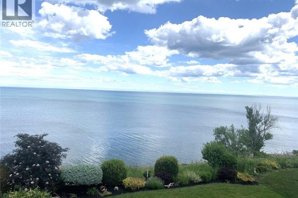 Aerial view of the waterfront community with houses and Lake Erie in the background - 80 New Lakeshore Road Unit# 16, Port Dover