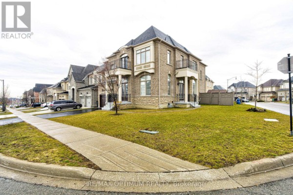 Wide angle of the house exterior, showing the lawn and surrounding neighborhood. - 80 Royal West Drive, Brampton