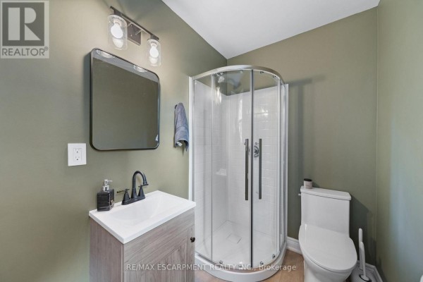 Glass-enclosed shower and vanity - 80 Sarah Street Brant