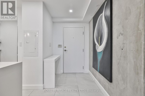Entryway with minimalist decor, large wall art, and tile flooring - 801 - 10 Torresdale Avenue, Toronto
