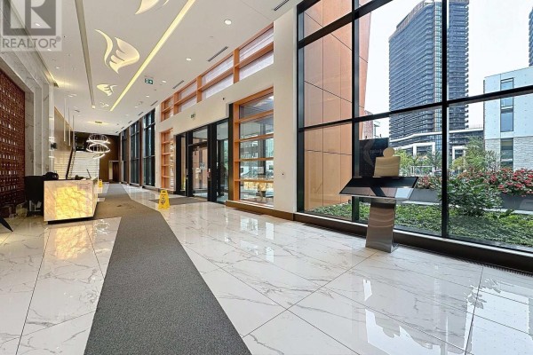 Lobby with marble floors, reception desk, and large windows. - 801 - 95 Mcmahon Drive, Toronto