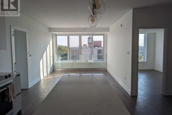 Bright living space with a large window overlooking the city. - 802 - 195 Hunter Street E, Peterborough