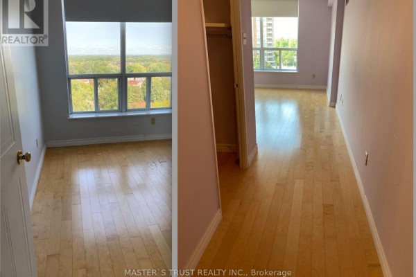 A small kitchen with light oak cabinets, dark granite countertops, and a white refrigerator. - 803 - 410 Mclevin Avenue, Toronto