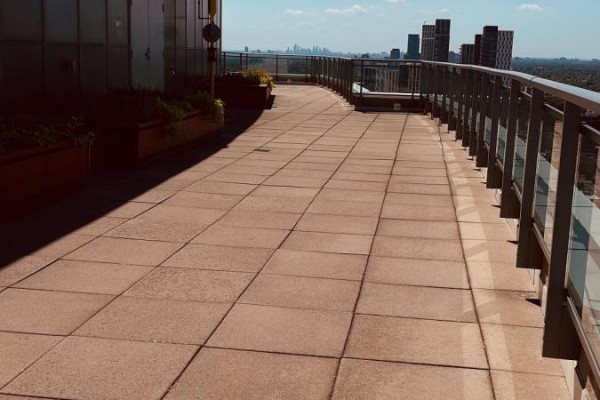 View from a high-rise balcony with metal railings and a panoramic view of Toronto skyscrapers. - 803 - 736 Spadina Avenue, Toronto