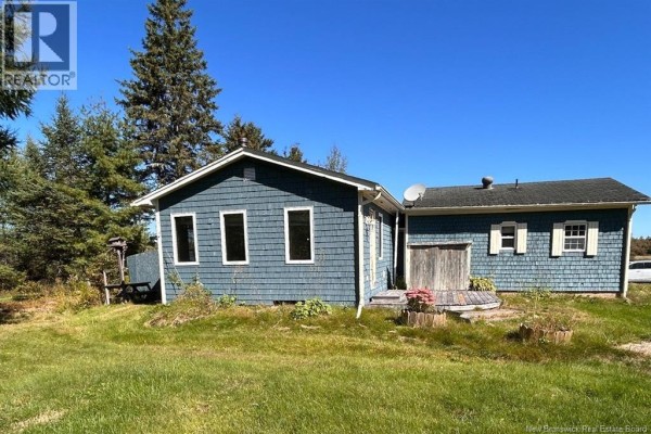Compact kitchen with wood cabinets, white appliances, and laminate flooring. - 8034 Route 134, Galloway