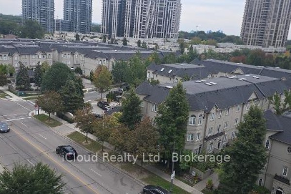 View of townhouses and distant skyscrapers from a high-rise apartment window. - 806 - 28 Avondale Avenue, Toronto