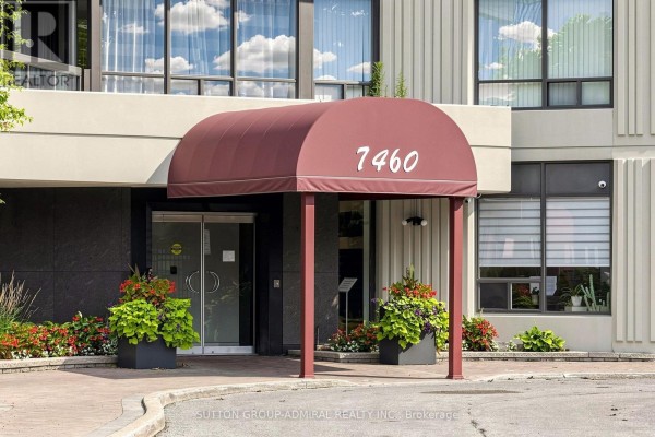 Maroon awning with "7460" signage over the main entrance of the apartment building. - 806 - 7460 Bathurst Street, Vaughan