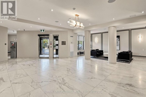 Spacious, modern lobby with marble tile floors and elevator access. - 806 - 7460 Bathurst Street, Vaughan